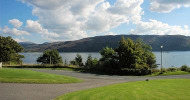 Tarlogie has a pleasant open-plan garden with a patio area from which there are excellent sea views across Loch Carron.